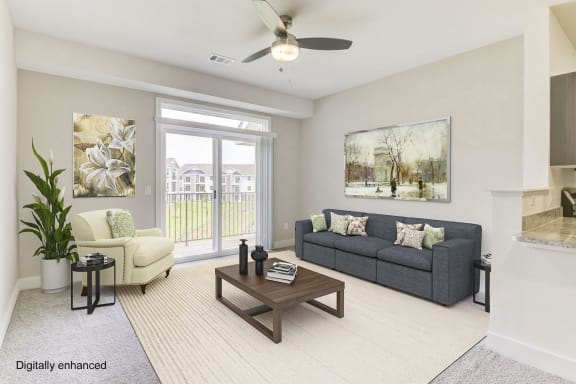 A living room with a 9' ceiling and a slider leading to a private balcony at Dodson Pointe Apartment Homes, Rogers, AR