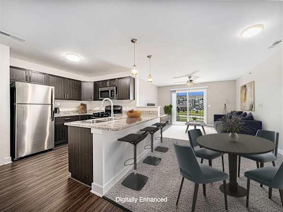 A modern kitchen with a dining table set for four at Dodson Pointe Apartment Homes, Rogers