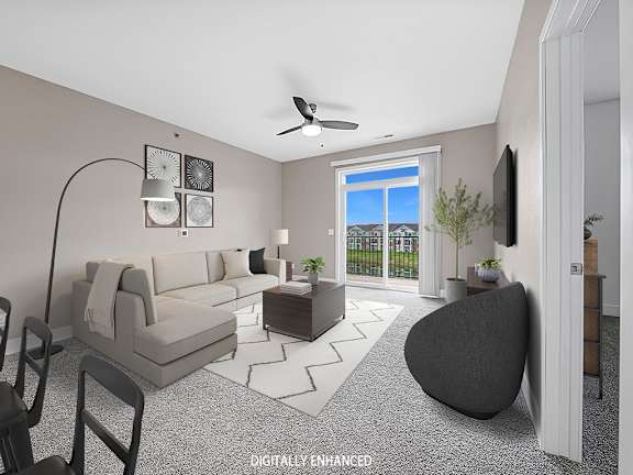 A modern living room with a 9' ceiling and ceiling fan A modern living room with a 9' ceiling and ceiling fan at Dodson Pointe Apartment Homes, Rogers