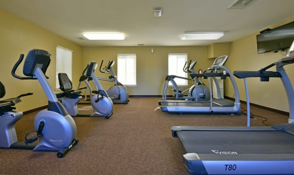 a gym with cardio equipment and exercise bikesat Windsor Place Apartments, Davison, MI