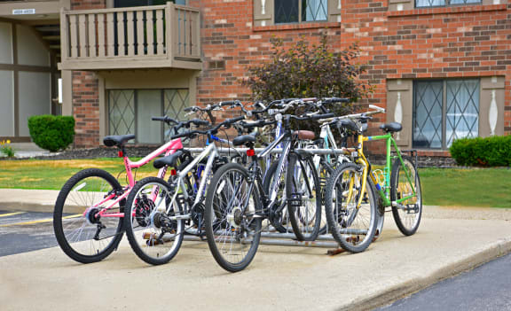 a group of bikes parked on a rack in front of a buildingat Woodland Place, Michigan, 48640