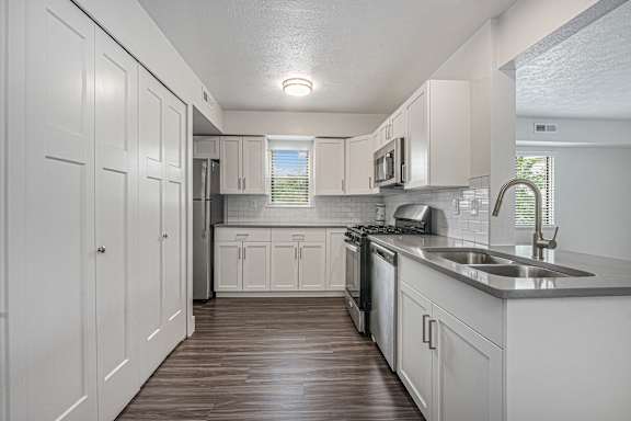 End style kitchen with window at Dupont Lakes Apartments in Fort Wayne, IN