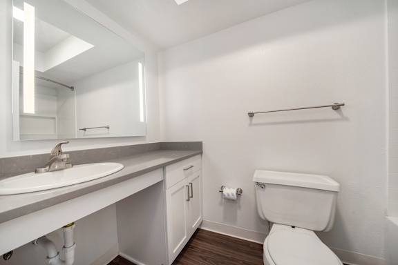 Bathroom with lighted mirror at Dupont Lakes Apartments in Fort Wayne, IN