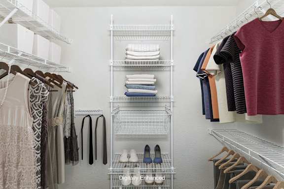 a walk in closet with organizers at Dupont Lakes Apartments in Fort Wayne, IN