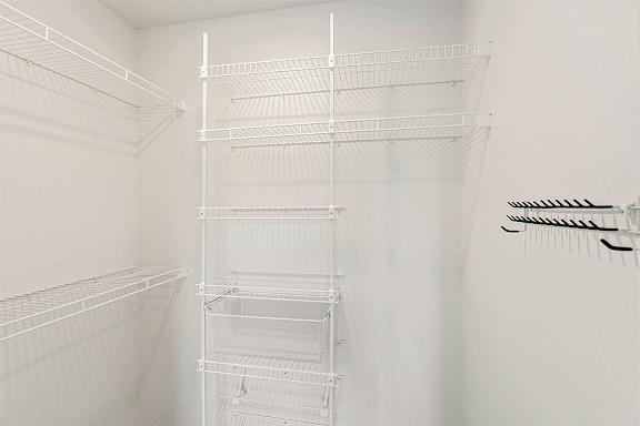 Walk-in closet with organizers at Eagle Ridge Apartment Homes, Traverse City, MI 49685