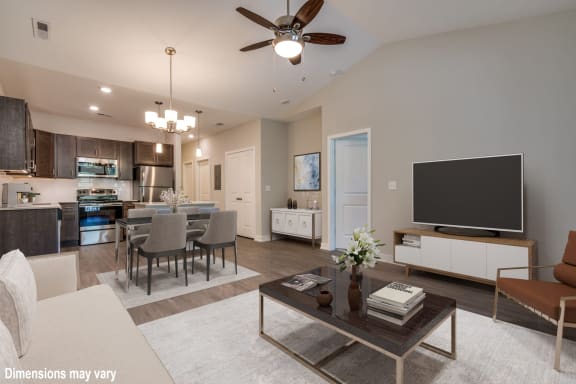a spacious living room with a large flat screen tv on top of a coffee table at Emerald Creek Apartments, Greenville, 29607
