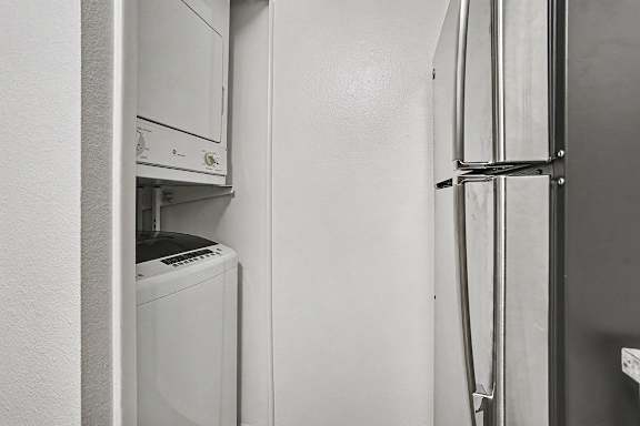 A washer and dryer in a kitchen at Emerald Park Apartments, Kalamazoo, Michigan