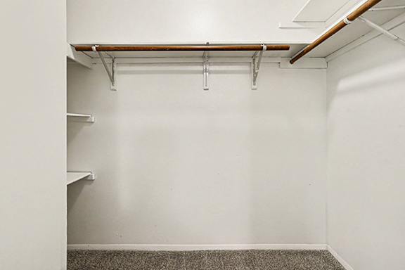 A walk-in closet with shelving at Emerald Park Apartments in Kalamazoo, MI 49001