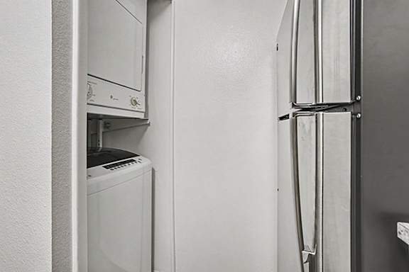A stackable washer and dryer at Emerald Park Apartments in Kalamazoo, MI 49001