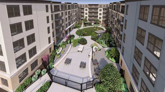 Interior courtyard with landscaped walking paths and gazebo at Icon on Main Apartments, Indiana