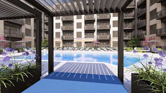 Poolside pergola with view of courtyard and water feature at Icon on Main Apartments, Carmel, Indiana