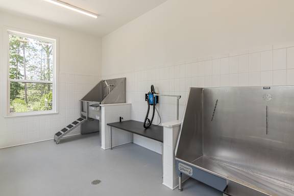 A clean, empty room with a large sink and a window at Luxe 360 on Centerpointe Apartments, Midlothian, Virginia