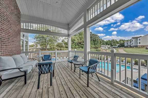 a covered porch with furniture on it at The Vinings Apartments in Richmond, VA 23234
