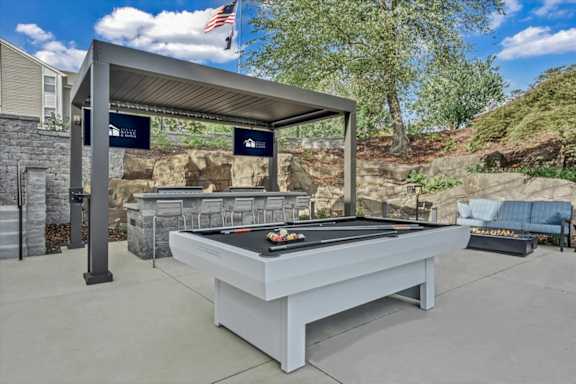 Patio with billiards table at The Vinings Apartments in Richmond, VA 23234