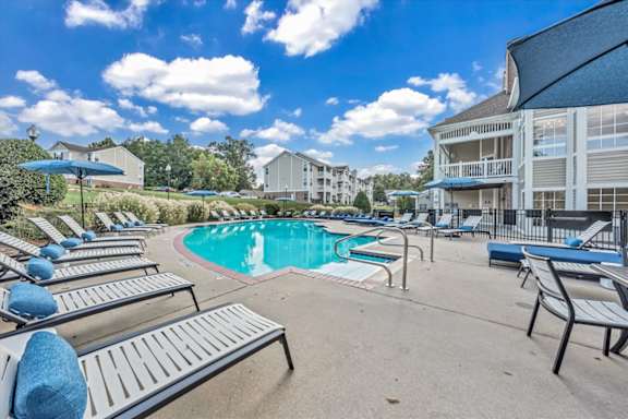 a resort style swimming pool  at The Vinings Apartments in Richmond, VA 23234
