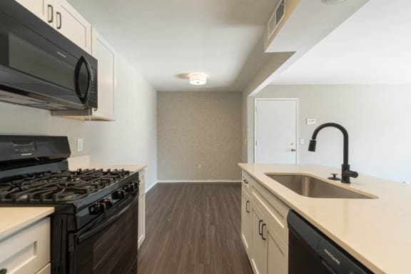a kitchen and dining area at Cordoba Apartments, Farmington Hills, MI