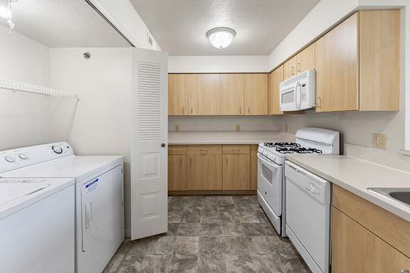 A kitchen with a washer and dryer at Fieldstream Apartment Homes, Iowa