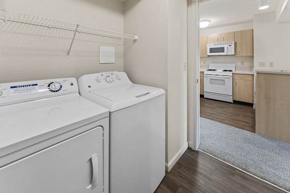 A laundry room with a washer and dryer at Fieldstream Apartment Homes, Iowa