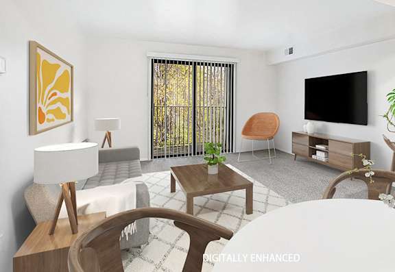 A modern living room with a grey sofa, a wooden coffee table, and a slider to a balcony A modern living room with a grey sofa, a wooden coffee table, and a slider to a balcony at Foxwood and The Hermitage, Michigan
