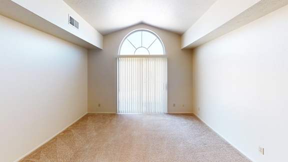 A living room with a large window and a cathedral ceiling A living room with a large window and a cathedral ceiling at Foxwood and The Hermitage, Portage