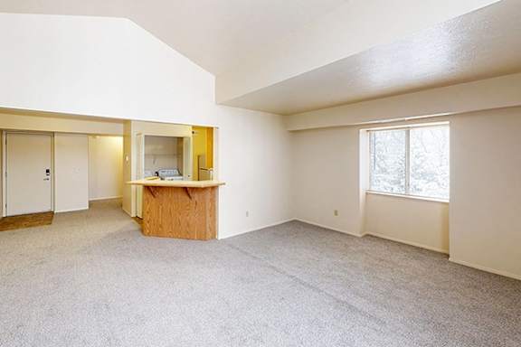 An enlarged living room with an extra window at Foxwood and The Hermitage, Portage, MI