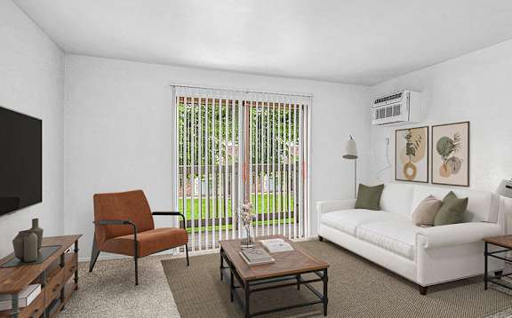 A living room with a slider to a balcony at Glen Oaks Apartments, Michigan, 49442offee table.