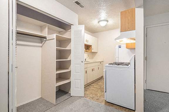A large closet with shelves at Glen Oaks Apartments in Muskegon, MI