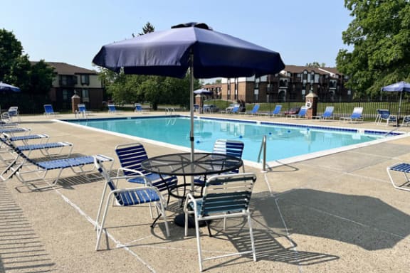 Pool With Large Sundeck and Wi-Fi at Granada Apartments in Jackson, MI
