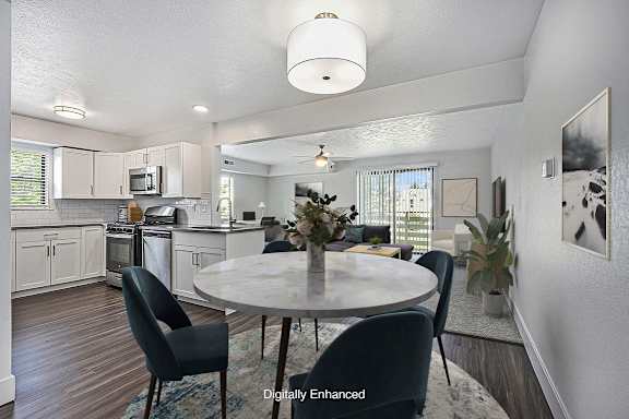 a modern kitchen with a window and dining room at Green Ridge Apartments, Grand Rapids, 49544