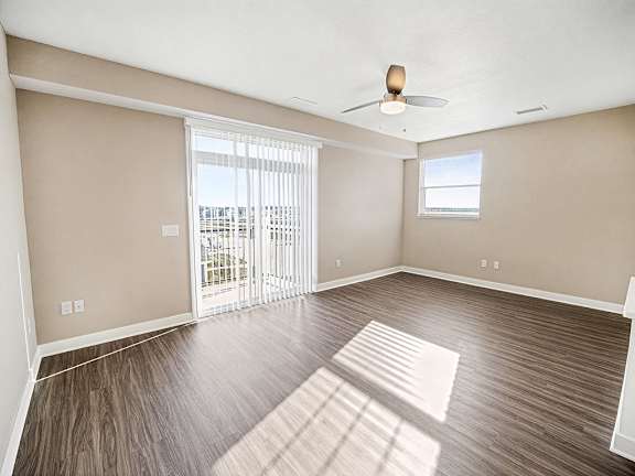 An enlarged living room with an extra window and a 9' ceiling at The Grove Apartment Homes in Lincoln, NE