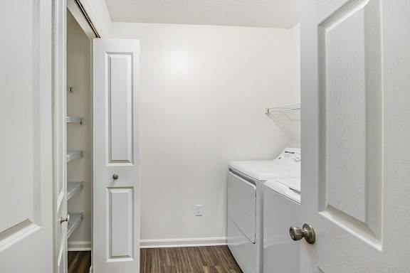 A laundry room with a full-size washer and dryer at Gull Prairie/Gull Run Apartments and Townhomes, Michigan, 49048