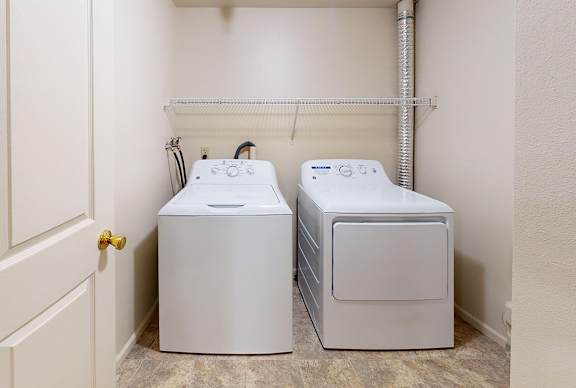 A laundry room with a full size washer and dryer at Gull Prairie/Gull Run Apartments and Townhomes, Kalamazoo, MI, 49048