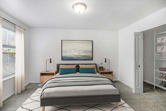 A bedroom with a large bed and window with a walk-in closet at Gull Prairie/Gull Run Apartments and Townhomes, Michigan, 49048