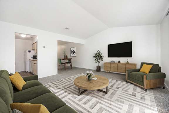 second floor living room with a cathedral ceiling at Hampton Lakes Apartments, Michigan, 49534