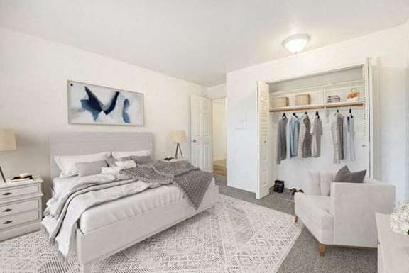 a bedroom with a large closet at Hampton Lakes Apartments, Walker, MI, 49534