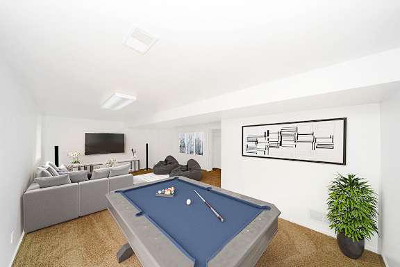 basement recreation room with a pool table at Foxwood and The Hermitage, Portage, MI, 49024