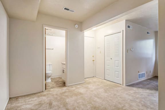 an empty room with a toilet and a closet at Hickory Village Apartments, Mishawaka