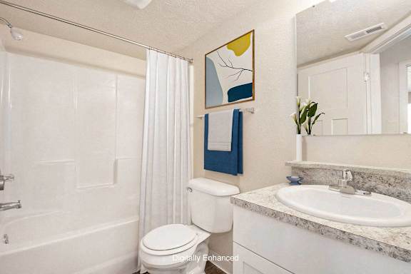 an upgraded bathroom with a sink toilet and a bath tub at Hickory Village Apartments, Indiana