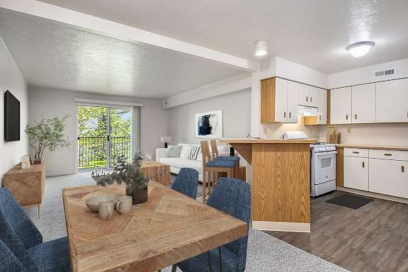 A modern kitchen with a dining table and chairs at The Highlands Apartments, Indiana