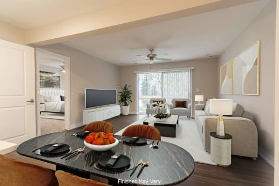 a living room and dining room with a large window and a ceiling fan at Hillside Apartments, Wixom, MI