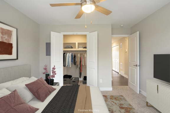 a bedroom with a large bed and a ceiling fan at Hillside Apartments, Michigan, 48393