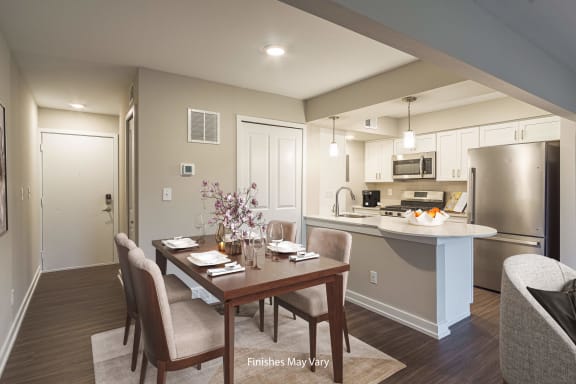 a kitchen and dining area in a 555 waverly unit at Hillside Apartments, Wixom, MI