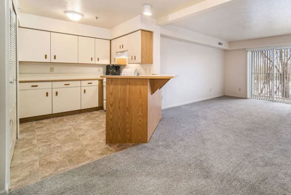 One bedroom kitchen with white appliances at Hurwich Farms Apartments in South Bend, Indiana