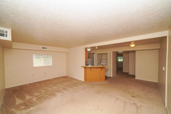 the living room and kitchen of an empty house  at Hurwich Farms Apartments, South Bend, 46628