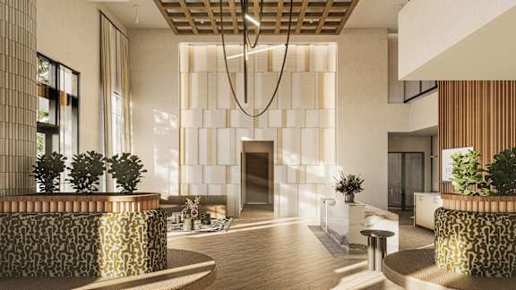 Elegant lobby entrance with textured wall and decorative ceiling at Icon on Main Apartments, Carmel