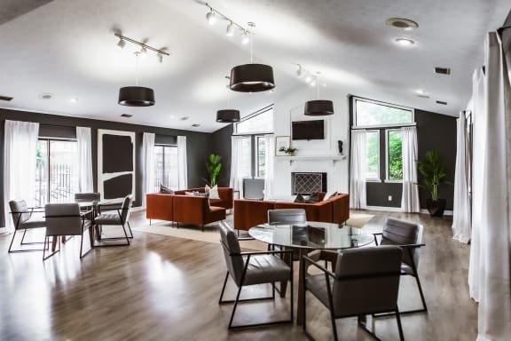 a large lounge with a fireplace and seating  at Bavarian Village Apartments, Indiana