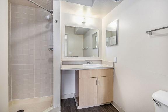 a bathroom with a sink and a mirror at Indian Lakes Apartments, Mishawaka, IN