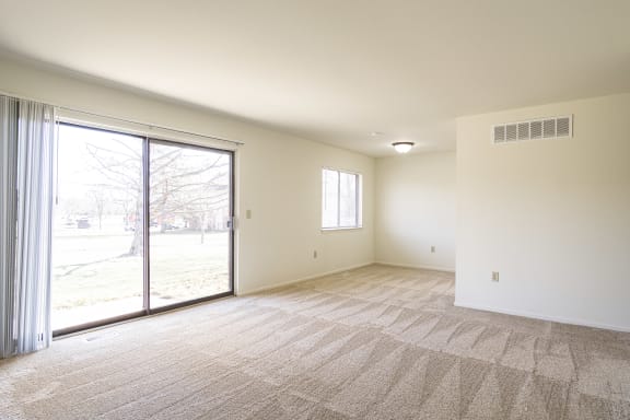 Carpeted Living Area at Rivers Edge Apartments, Waterford Twp, Michigan