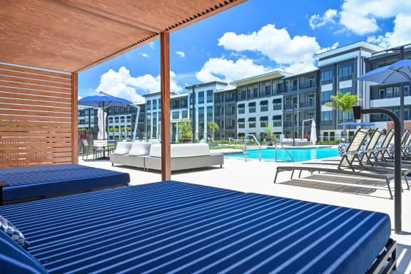 take a dip in the pool at the bradley braddock road station apartments  at Ironwood Flats, Florida, 33511