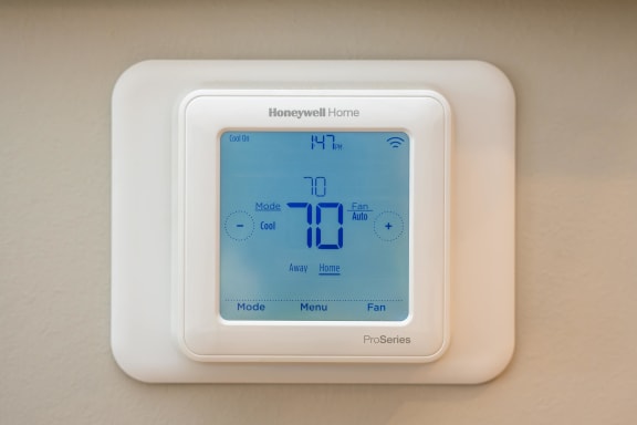 a thermostat on a hotel room wall at Ironwood Flats, Brandon